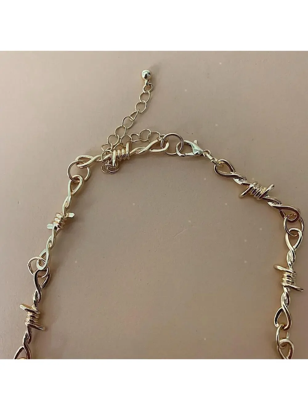 Y2k gold barbwire opium punk style chocker necklace. Cool design. Nice quality.